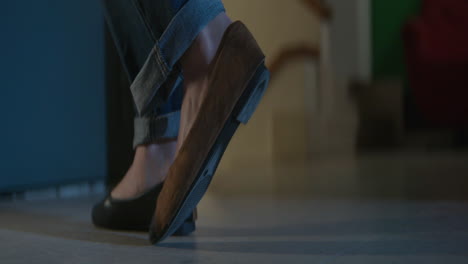 woman's feet in jeans and shoes