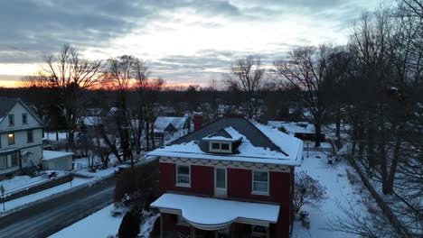 american one family house with american flag during winter season