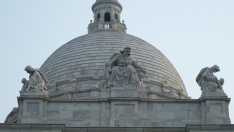 close-up of the victoria memorial dome with elaborate marble sculptures
