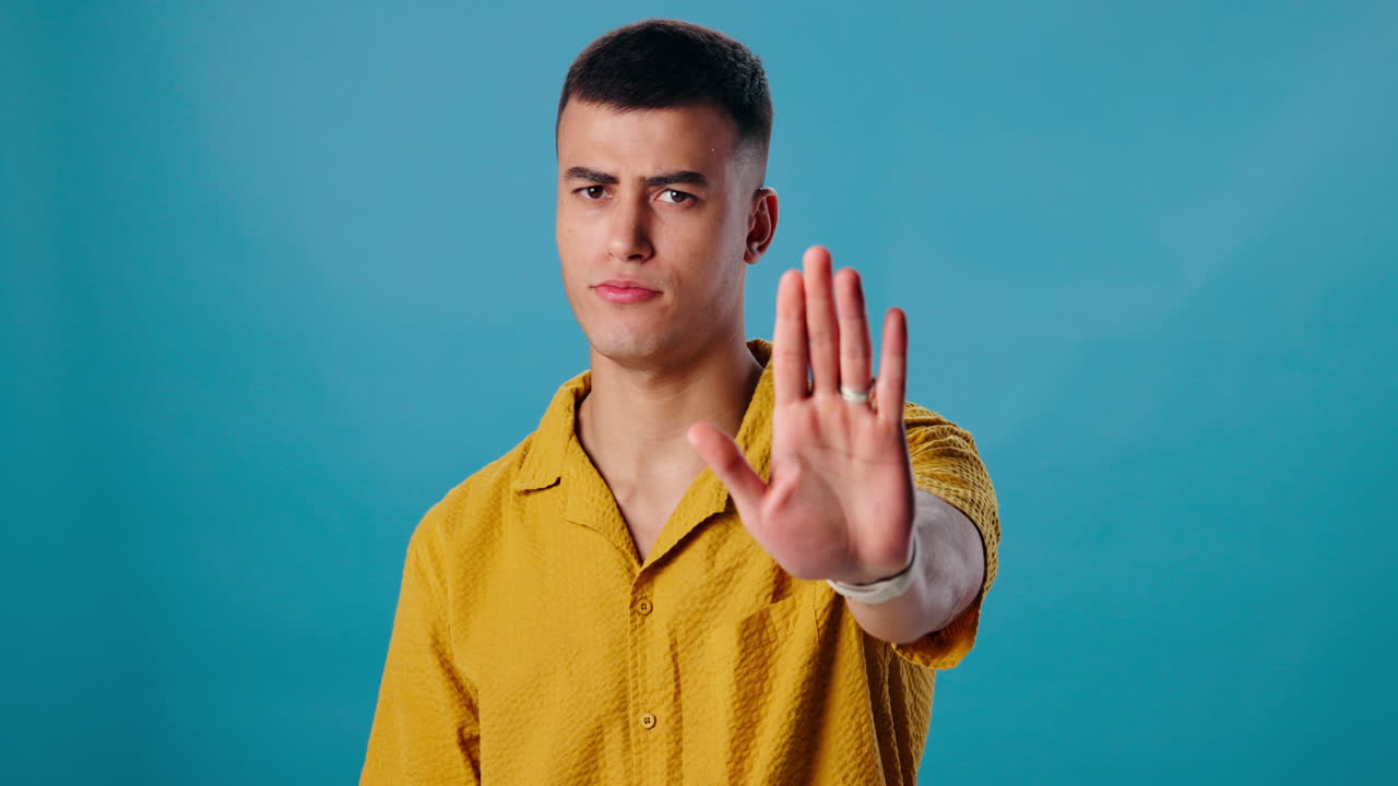 Man Showing Stop Hand Gesture