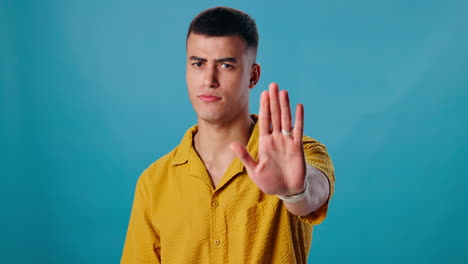 man showing stop hand gesture