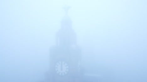 dense fog cover aerial view ghostly liverpool liver building in thick gloomy weather visibility