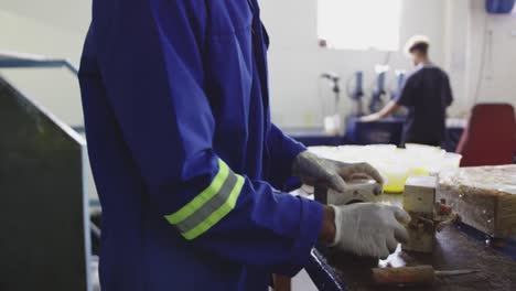 mixed race man working in factory