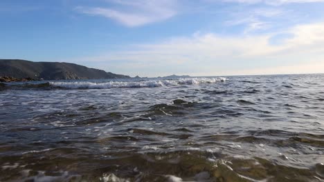 pov shot of person walking into the mediterranean sea