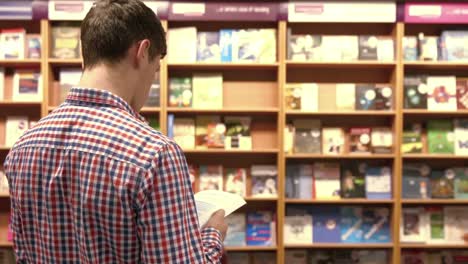 student reading book in library