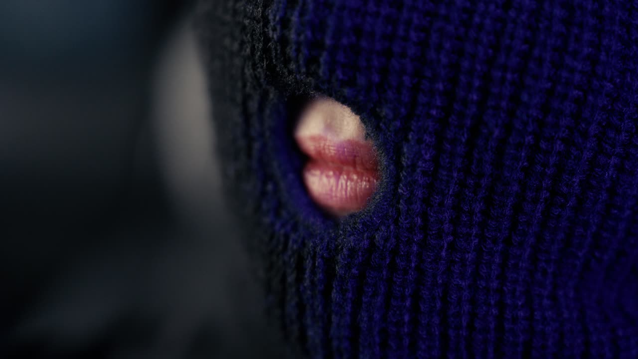 Beautiful Woman with Red Lips Behind Black Ski Mask – Mysterious Close-Up