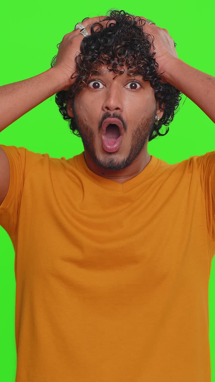Excited amazed man surprise looking at camera with big eyes shocked by sudden victory wow emotion