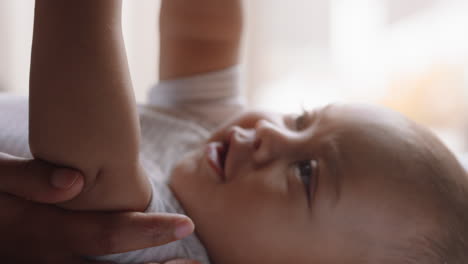 close-up-mother-with-baby-nurturing-happy-toddler-at-home-loving-mom-soothing-infant