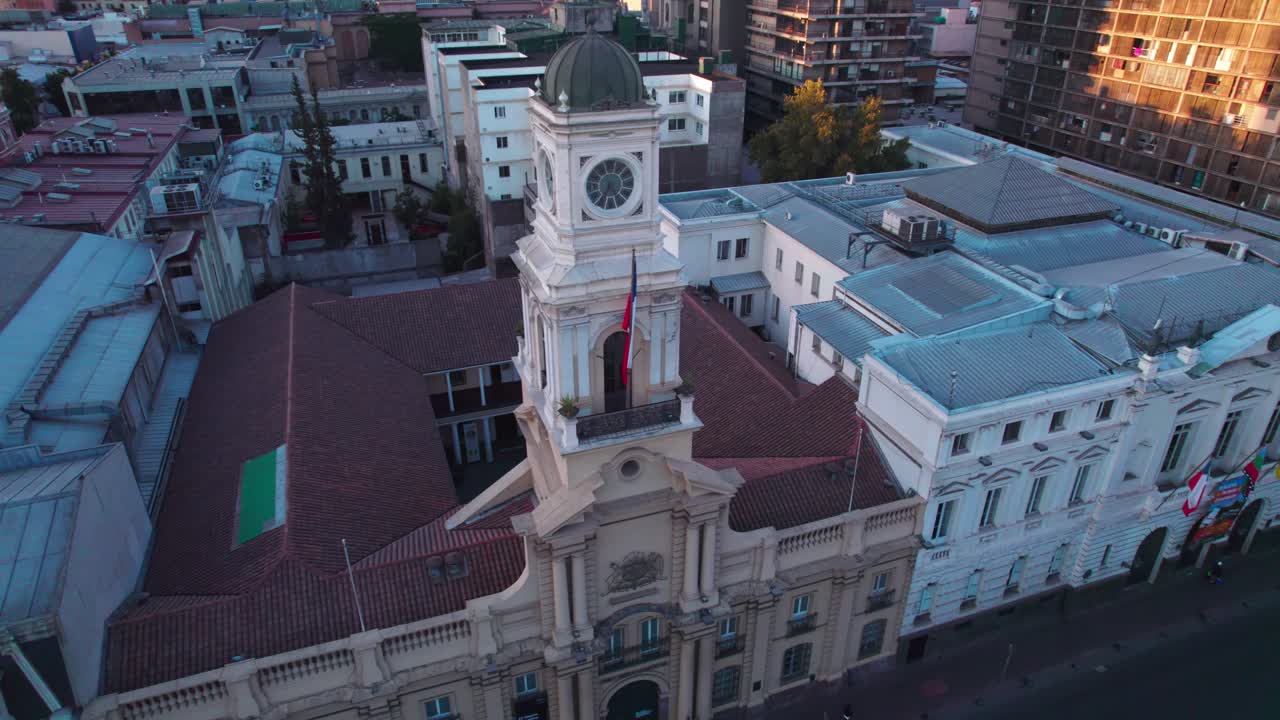 Museo Hist&oacute;rico Nacional aerial view orbiting across Plaza de Armas, Santiago main square and royal palace