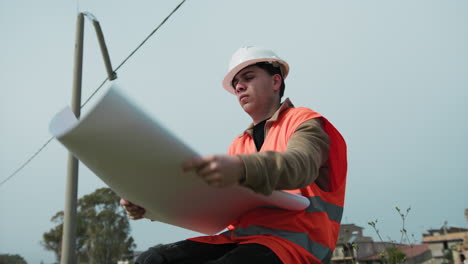 construction builder giving a look at the project document