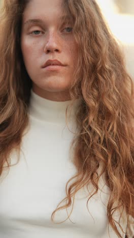 portrait of a woman with curly hair