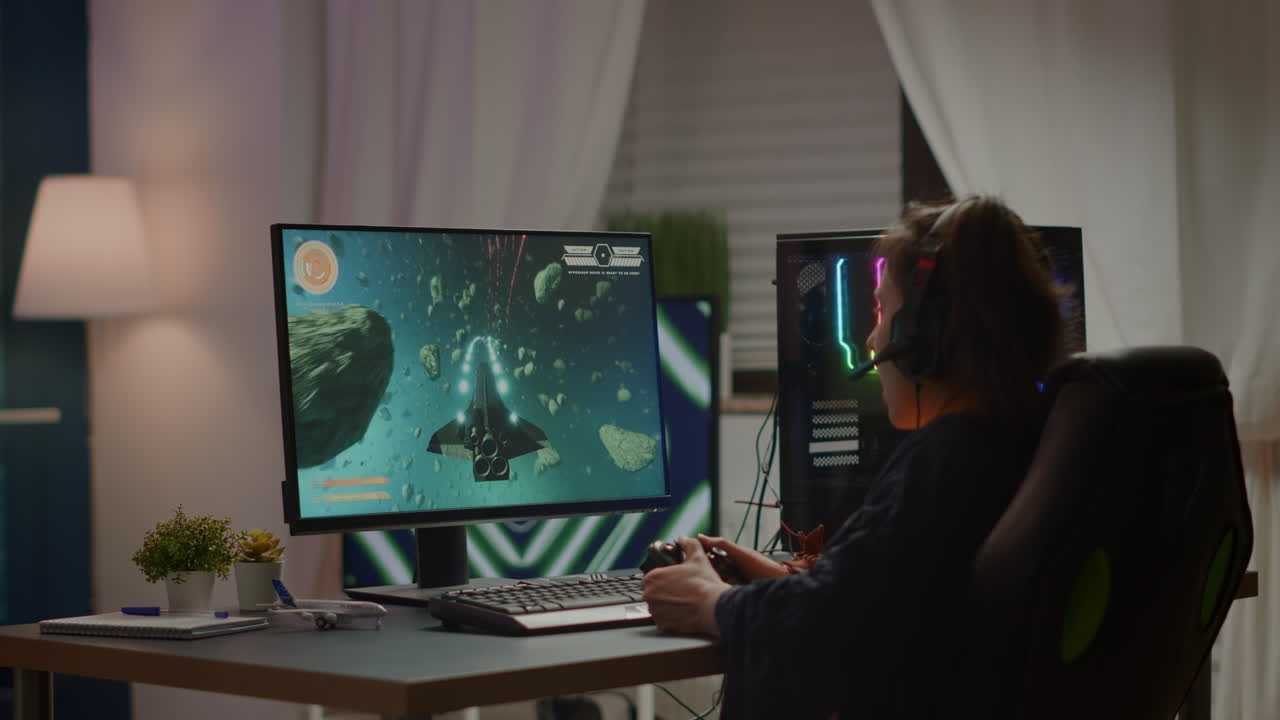 Back view shot of excited woman gamer wining online video games