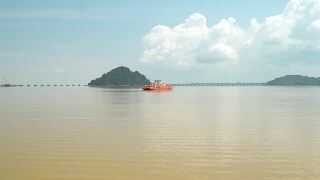 Batang Lupar Sarawak River Ferry Ride View During Summer And Under Construction Longest Bridge Conecting From each side,Sarawak,Borneo.