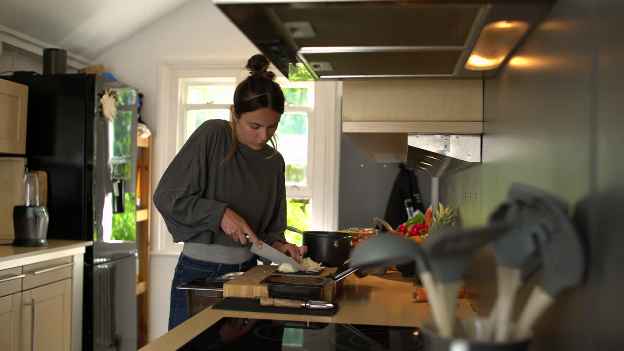 Young Woman Dicing White Onion 