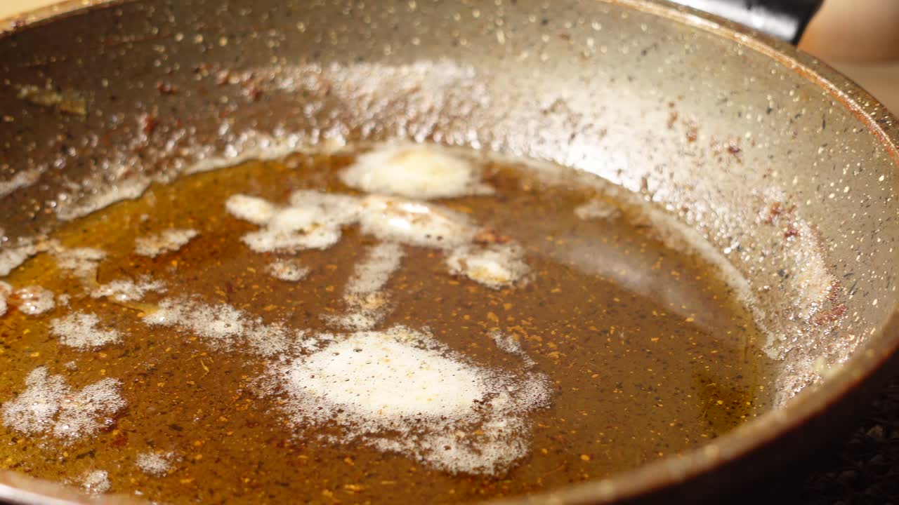 Used cooking oil in a frying pan