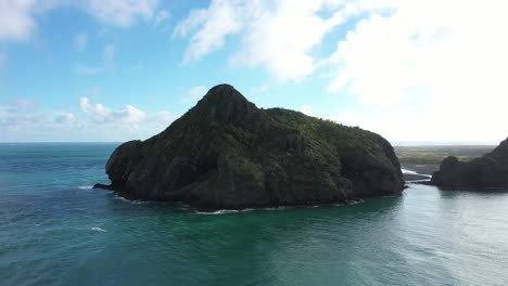 panorama view of whatipu beach with rocky formations huia reserve, new zealand