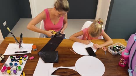 mother and daughter creating art at home