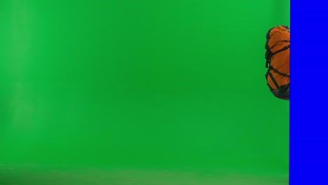hiker with backpack on green screen