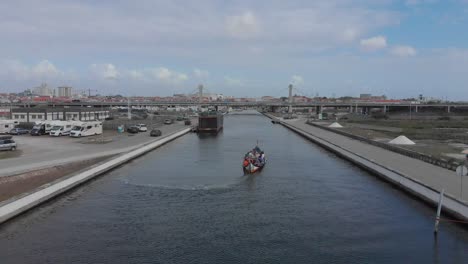 aerial footage from one of aveiro´s coastal canals and it´s traditional boats, the moliceiros