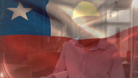 animation of flag of chile over biracial engineer wearing helmet walking with blueprints