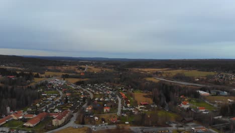 drone slowly panning over a remote village in sweden