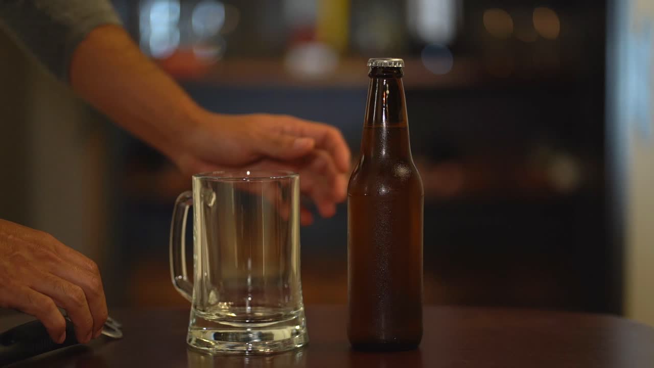 Deciding to drink alcohol. Hesitating to open bottle