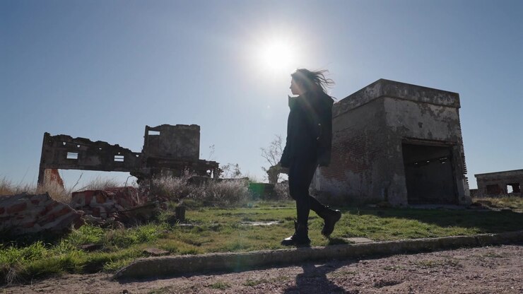 Lonely Woman Walking Through Abandoned Ruins of Villa Epecuen Argentina