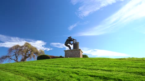 the napa valley, the grape crusher sculpture medium push in on famous landmark in wine country