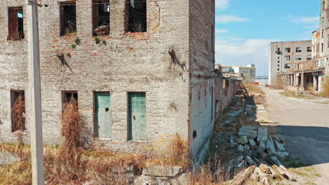flight over the destroyed factory. old industrial building for demolition. aerial view