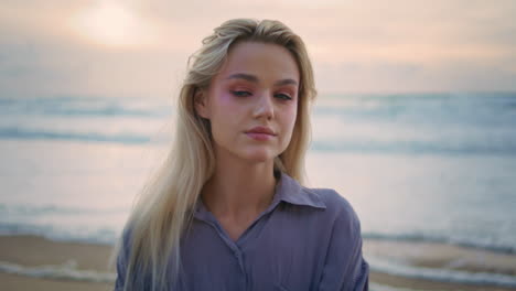 attractive girl posing sunset shore closeup. beautiful woman resting cloudy sea