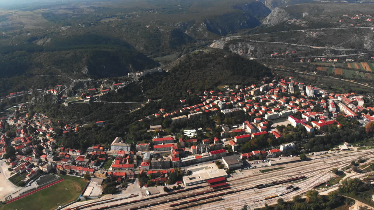 Push over the Croatian city of Hvar with its big railway station and old, historic fortress on the mountain.