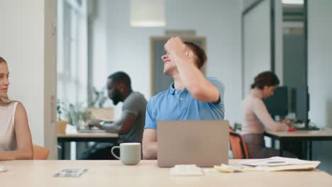 happy business man turning round on chair at coworking space