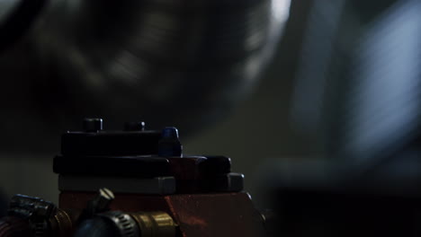 close up shot of a bolt being electrically welded into a metallic part