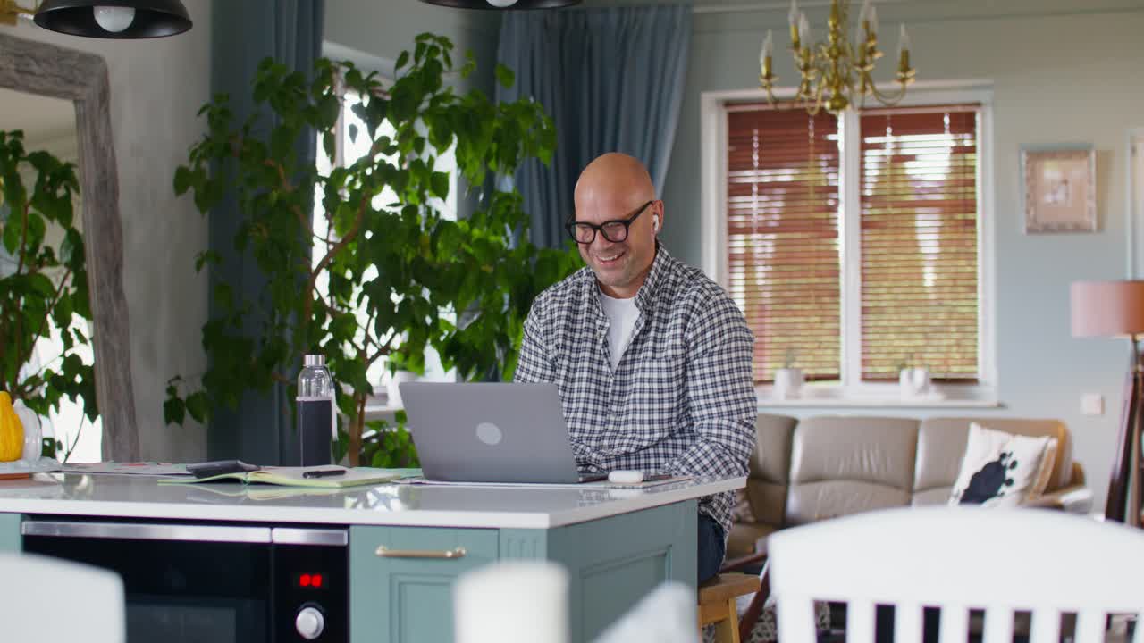 Man having a video call in his kitchen