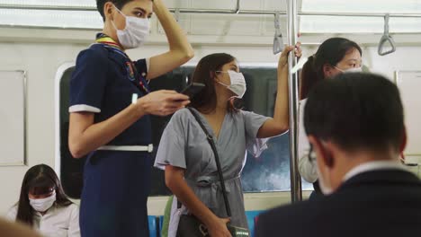 Crowd-of-people-wearing-face-mask-on-a-crowded-public-subway-train-travel