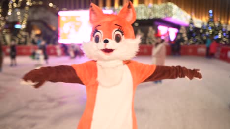 fox costume character ice skating at a christmas ice rink