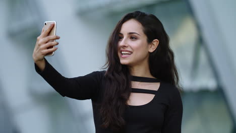 portrait of business woman laughing with smartphone