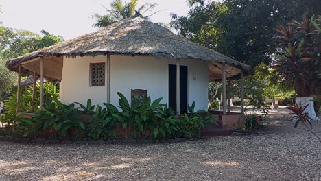 typical african house white and covered with thatched roof