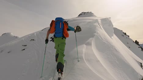 Ski-touring-with-a-ski-mountain-guide-on-top-of-the-mountain-in-tyrol