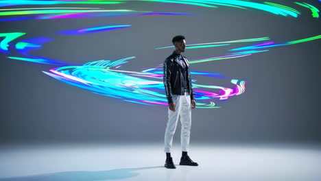 stylish man posing against vibrant abstract light background