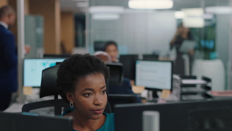 business woman meeting with colleague using computer team leader pointing at screen helping coworker discussing strategy in corporate workplace