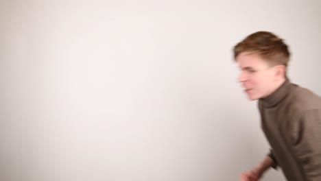 man grabbing and pulling something on a white background