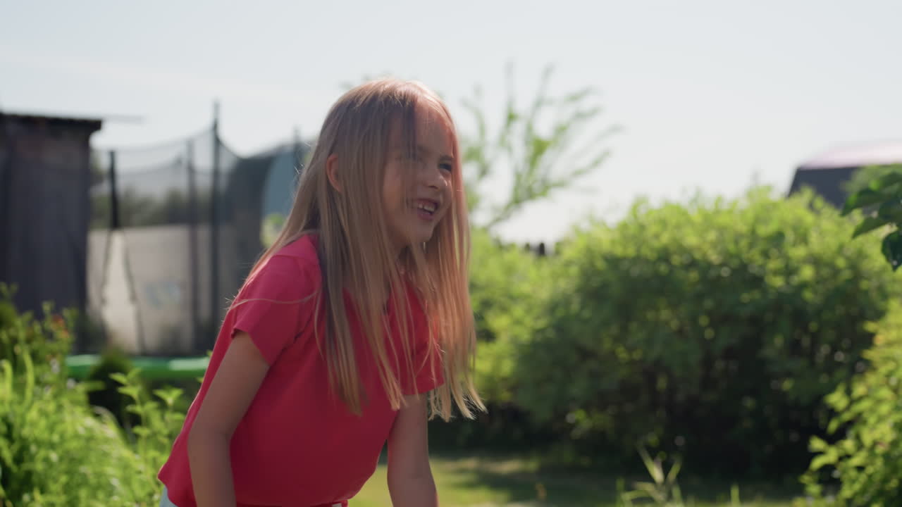 Sunny Backyard Sports Activity, Caucasian Girl Engaging In Energetic Backyard Badminton Session, Female Youth Executing Vigorous Overhead Serve During Outdoor Summer Badminton Practice