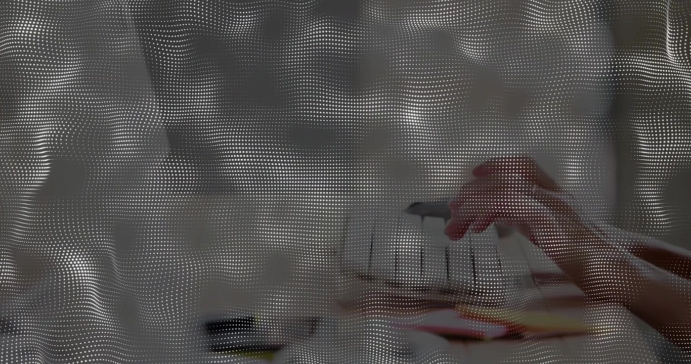 Hands appearing behind mesh curtain starting rhythmic typing on laptop keyboard showing workflow