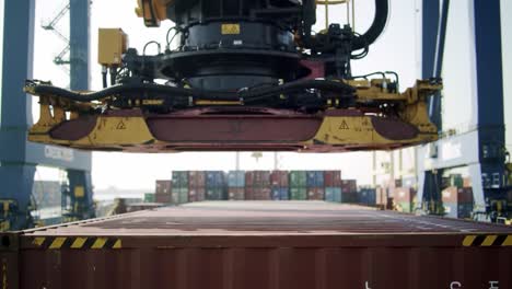 advanced crane technology in action: automated system lifting a shipping container at the port, demonstrating efficient cargo handling and logistics operations.