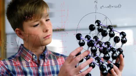 animation of mathematical formulae over smiling schoolboy