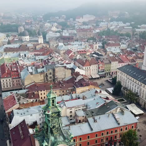 top view of old cathedral in the center of the ancient city of lviv. roofs of architectural landmark and old buildings in the city. camera moves around. aerial view.