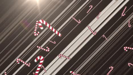 Animation-of-candy-cane-falling-over-glowing-rays-on-black-background