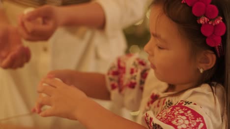 mother and daughter preparing for christmas celebration