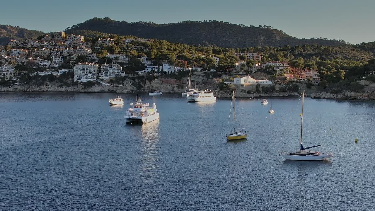 Aerial view of boats on the water in Mallorca, Spain at sunset